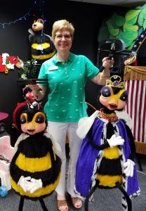 Melissa St. Clair holding Spectrum Puppets
